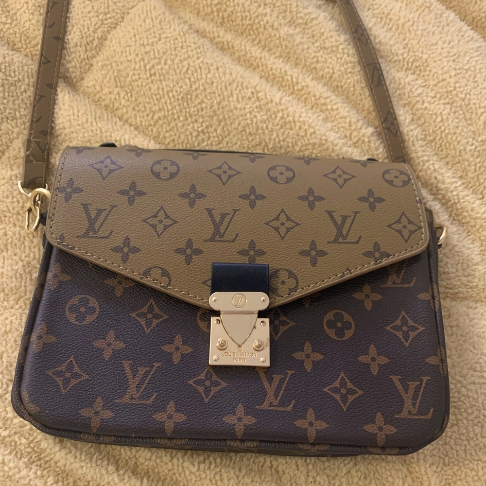 Brown and tan purse with adjustable strap